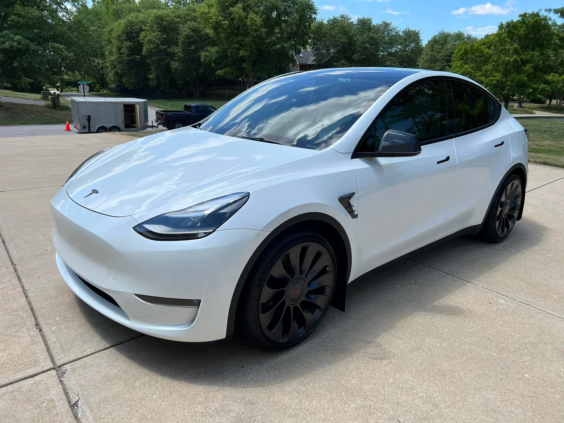 White Tesla Model Y exterior detailing with wax finish in Bixby
