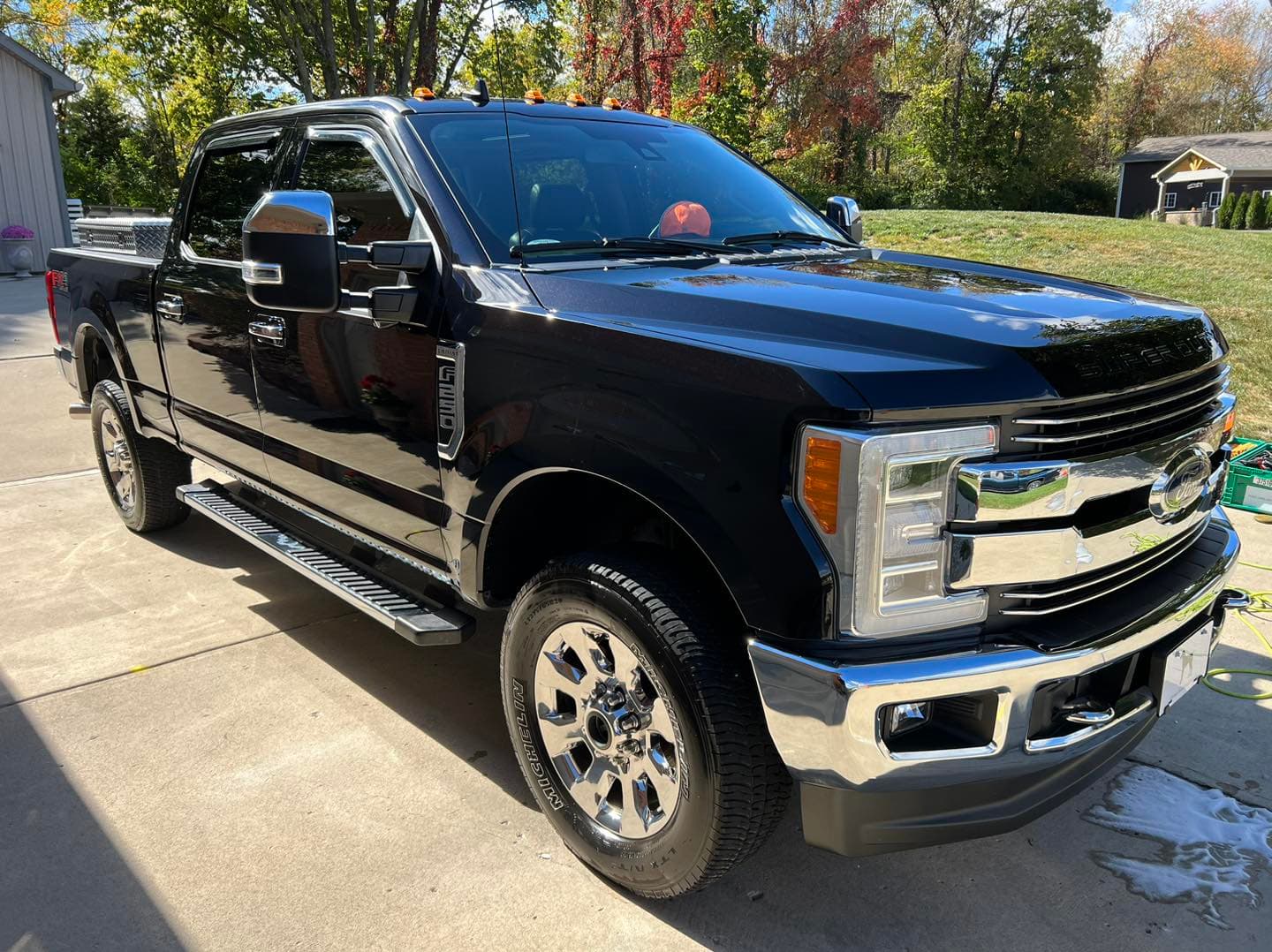 Black Ford F-250 Super Duty exterior detailing with wax finish in Glendale