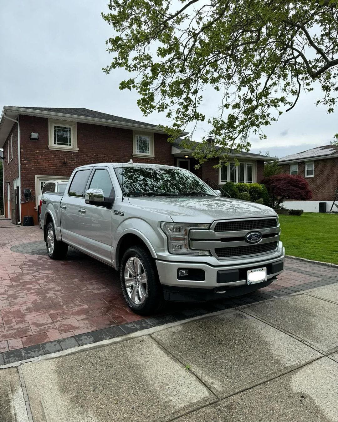 Silver Ford F-150 Platinum exterior detailing with wax finish in Noblesville