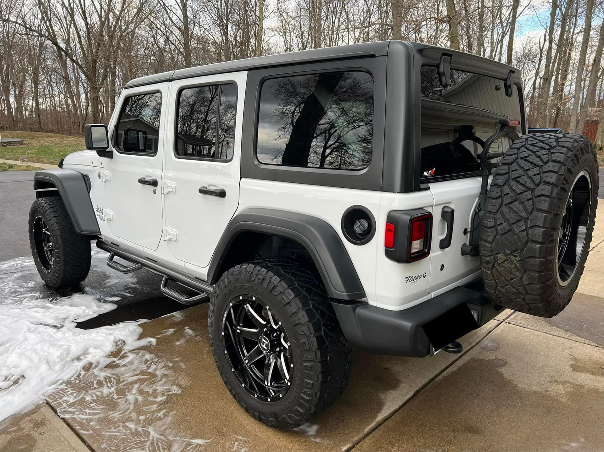 White Jeep Wrangler Unlimited exterior detailing with wax finish in Roswell