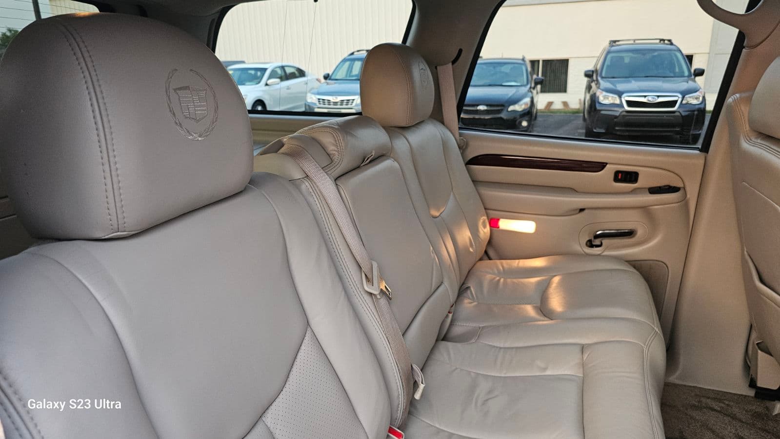 Tan leather Cadillac SUV second-row seats cleaned in Alpharetta