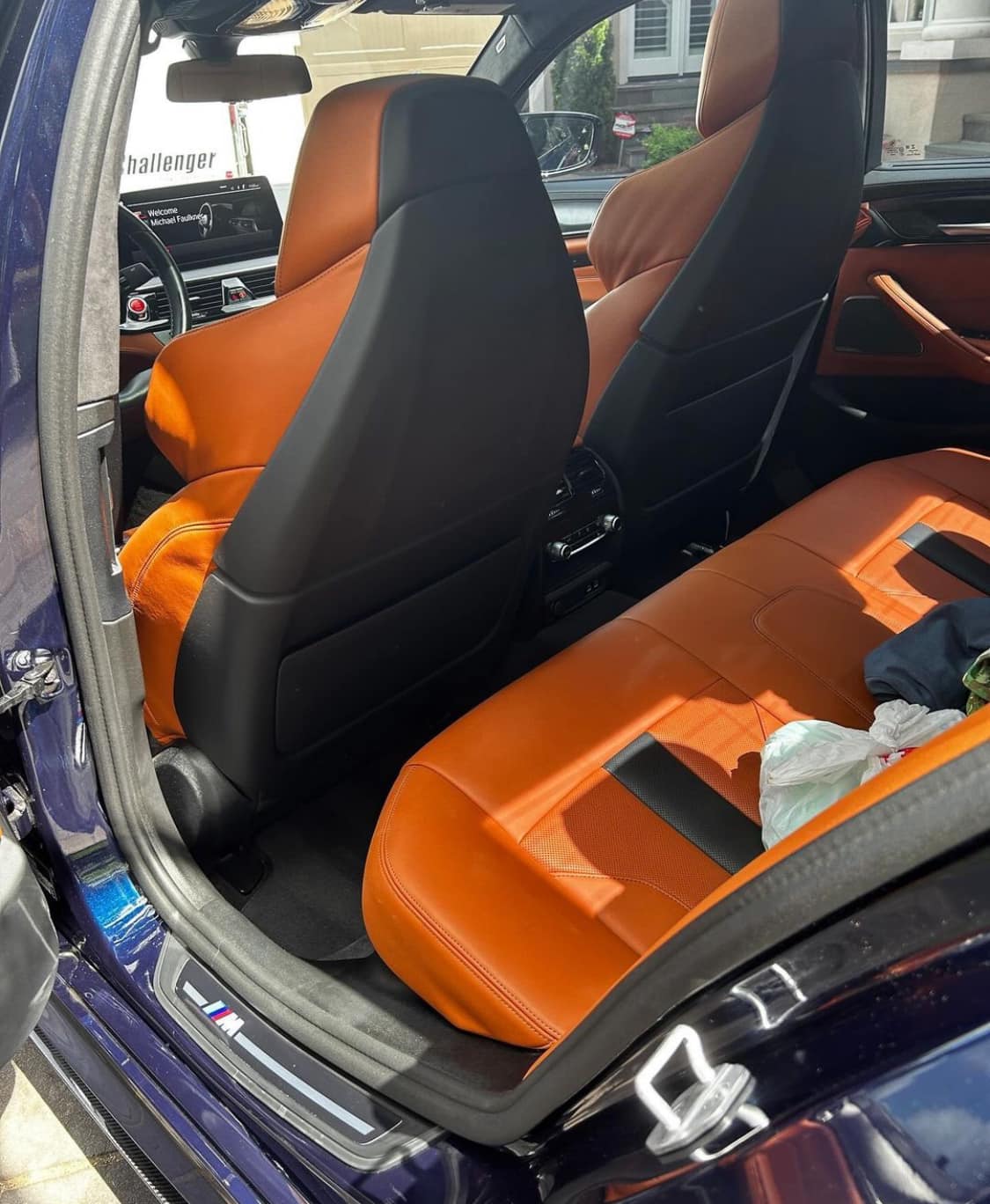 Orange and black leather BMW M-series rear cabin interior detailed in Dublin