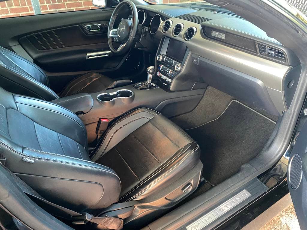 Black leather Ford Mustang front seats and dashboard cleaned in Frisco