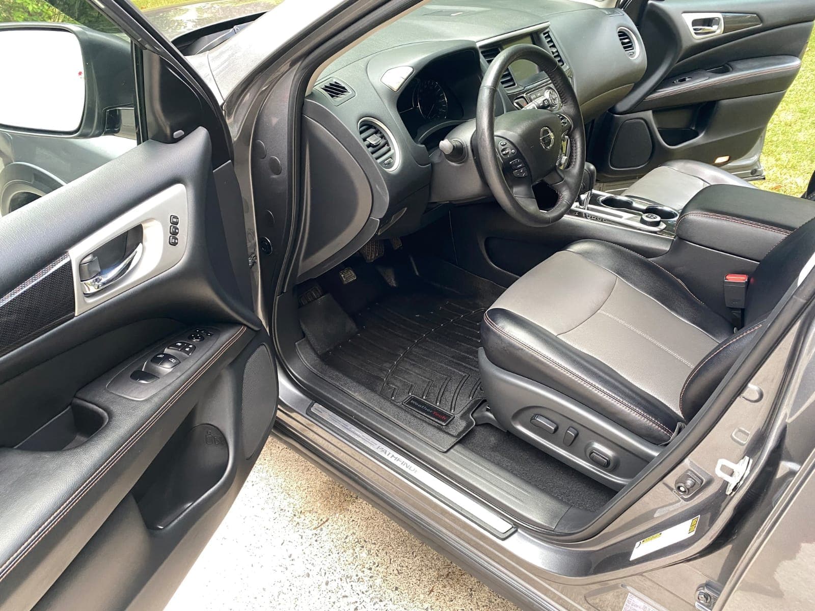 Black and gray leather Nissan Pathfinder interior detailed in Santa Monica