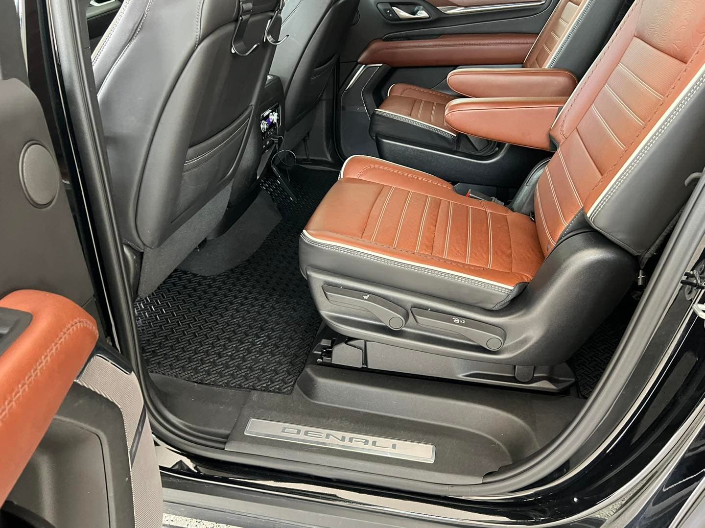 Brown and black leather GMC Denali second-row captain chairs cleaned in St. Petersburg