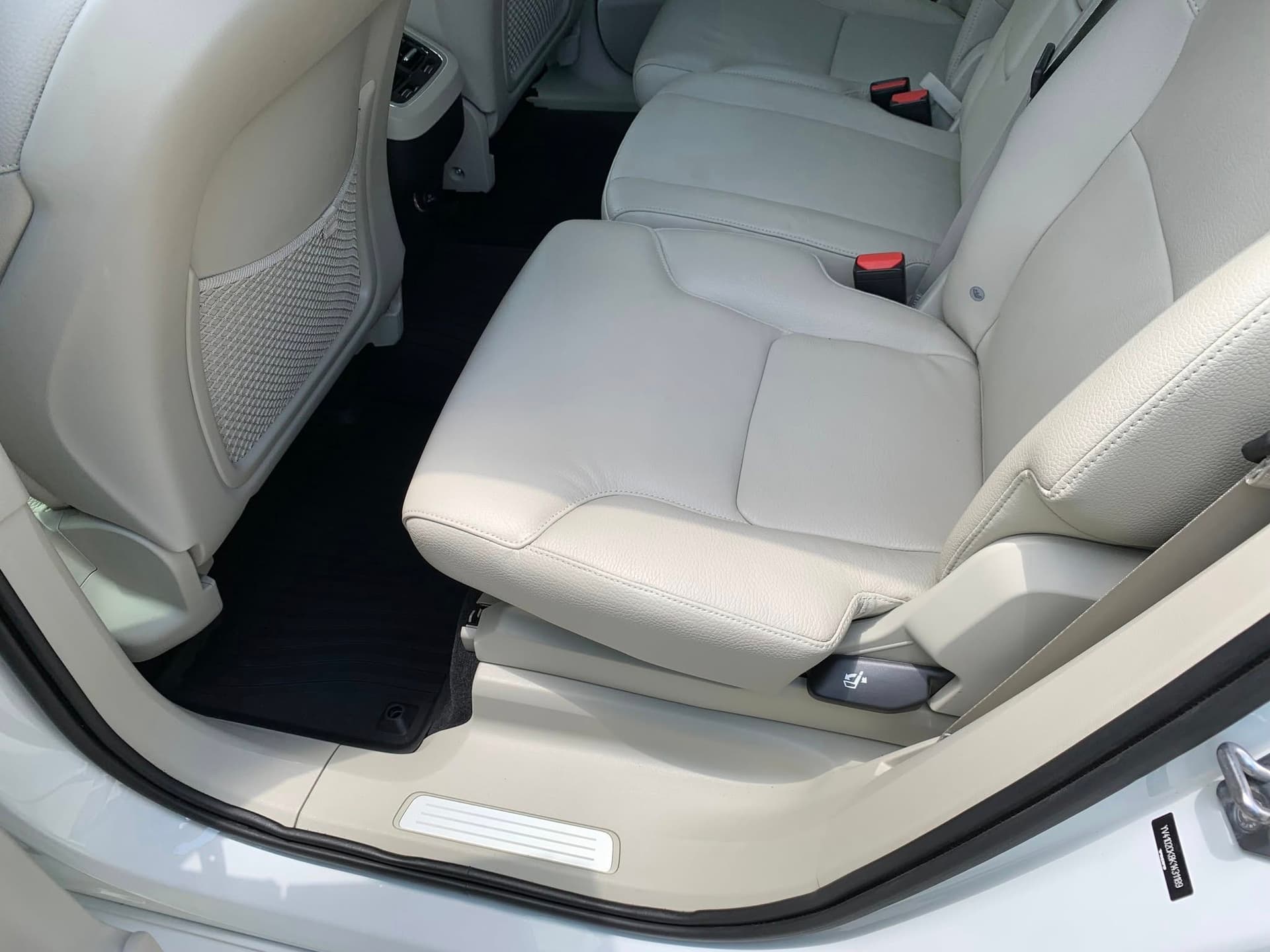 Light gray leather Volvo rear row seats and black mats cleaned on Tybee Island
