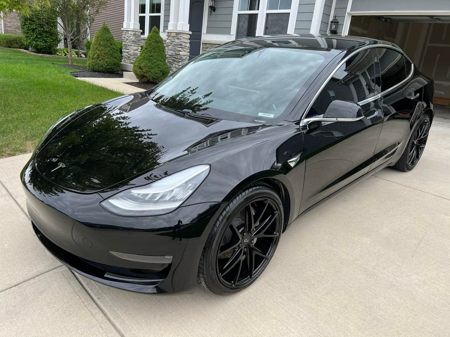 Black Tesla after paint correction and ceramic coating