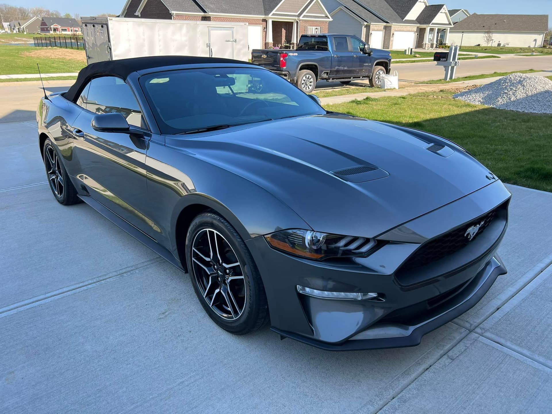 Metallic grey Ford Mustang with mirror-like ceramic-coated paint shine outdoors