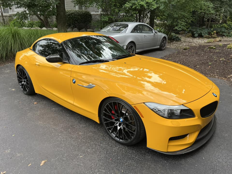 Yellow BMW roadster with vibrant ceramic-coated glossy finish