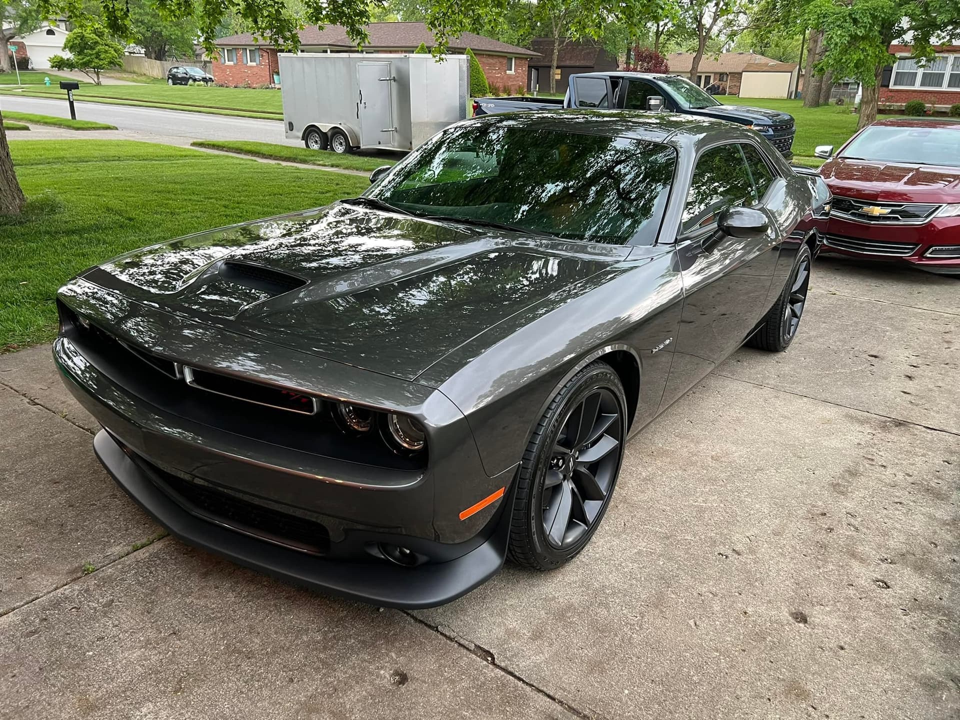 Dark gray Dodge Challenger with restored paint clarity after mobile compounding