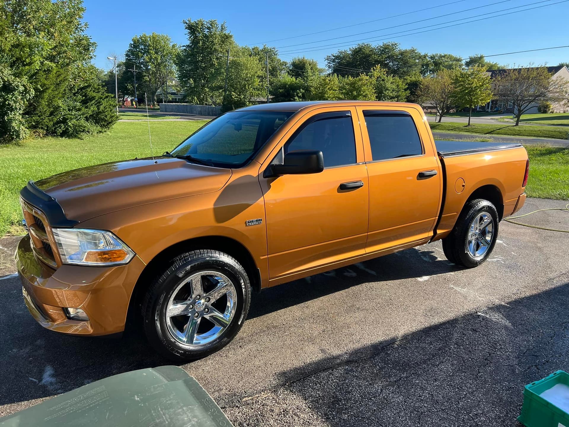 Orange Ram pickup truck with restored exterior shine after mobile detailing