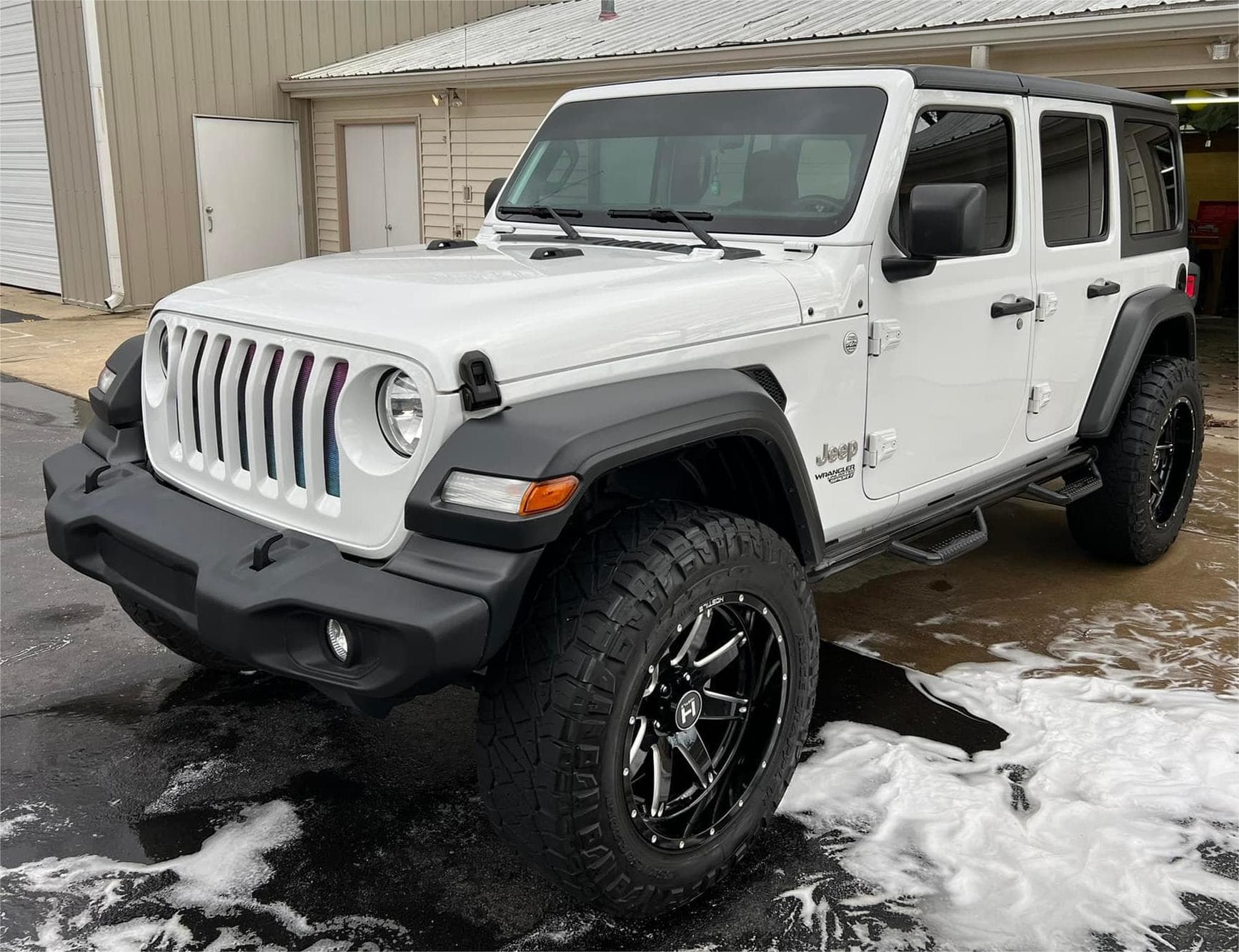 White Jeep Wrangler with clean glossy finish after mobile exterior detailing