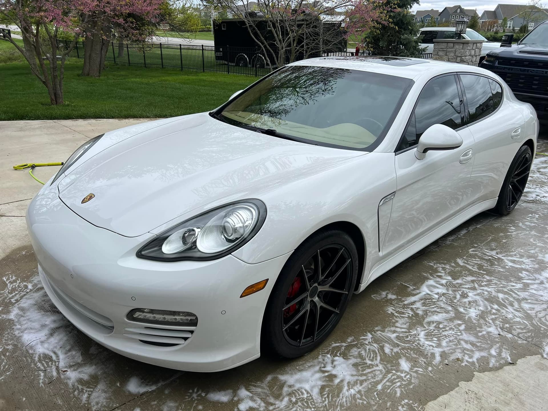 White Porsche Panamera with clean glossy finish after mobile car detailing